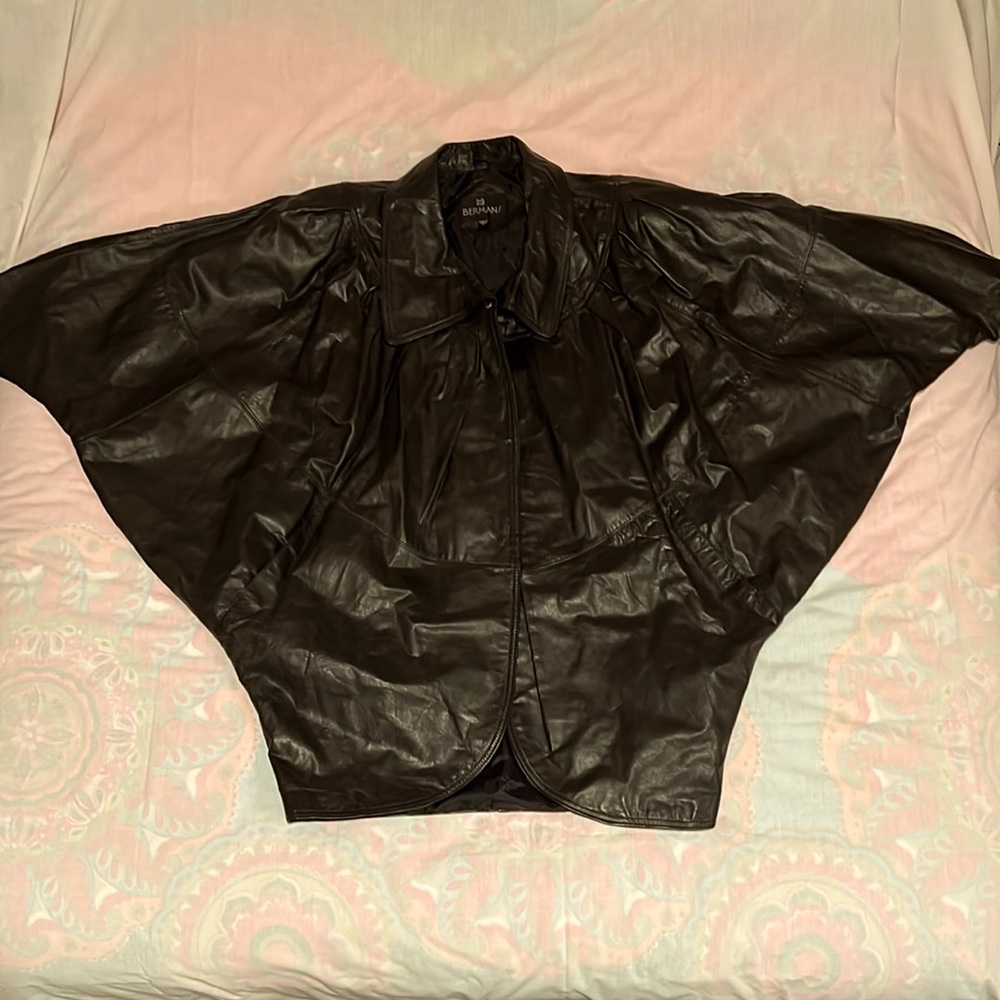 Women’s black leather cape/jacket. Size large.